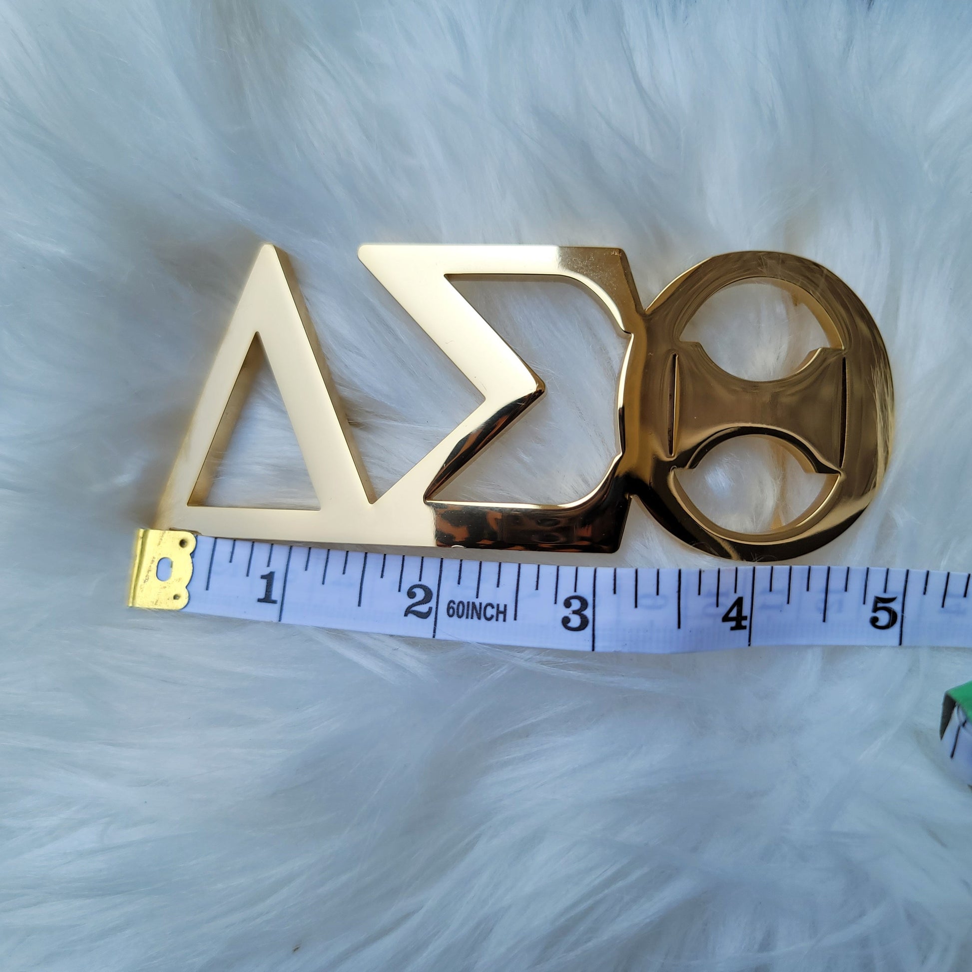 Sorority Greek letter belt Made from quality material, the buckle will not tarnish nor fade Material: stainless steel (with belt buckle only, belt not included) height 1.575 inche, width 4.6 inches. The weight of the buckle is approximately 1lb.