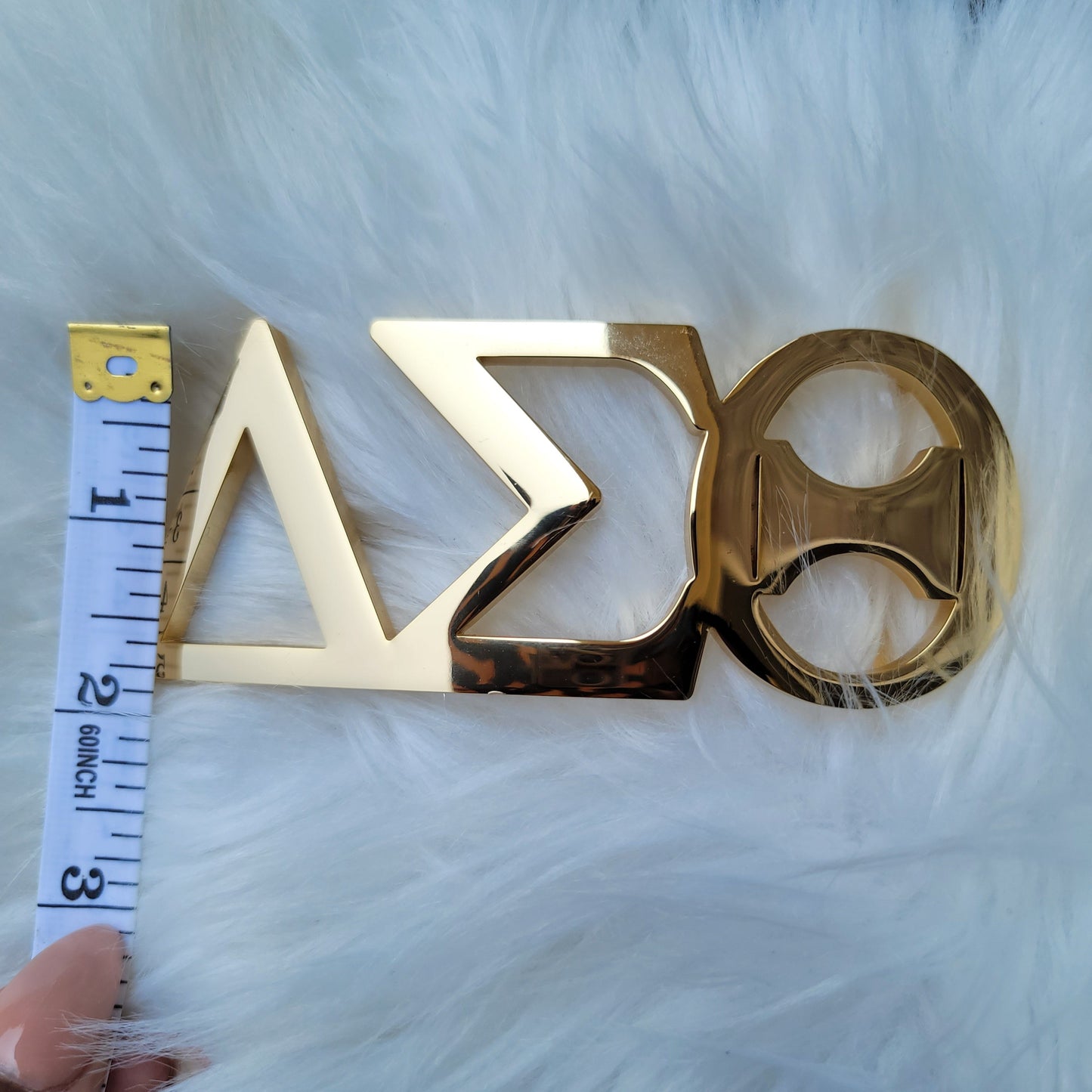 Sorority Greek letter belt Made from quality material, the buckle will not tarnish nor fade Material: stainless steel (with belt buckle only, belt not included) height 1.575 inche, width 4.6 inches. The weight of the buckle is approximately 1lb.