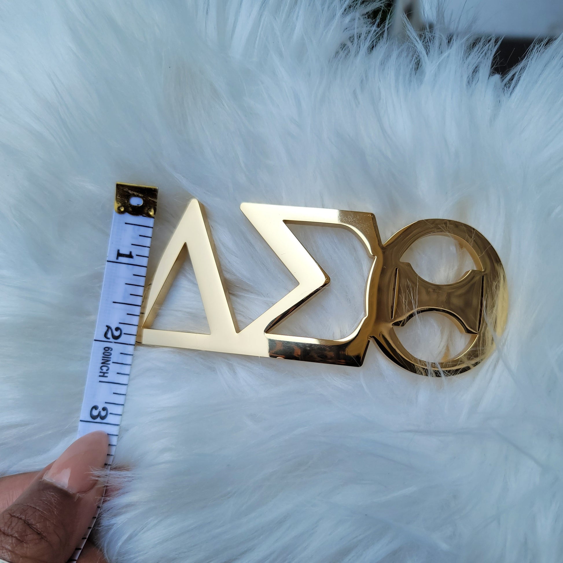 Sorority Greek letter belt Made from quality material, the buckle will not tarnish nor fade Material: stainless steel (with belt buckle only, belt not included) height 1.575 inche, width 4.6 inches. The weight of the buckle is approximately 1lb.