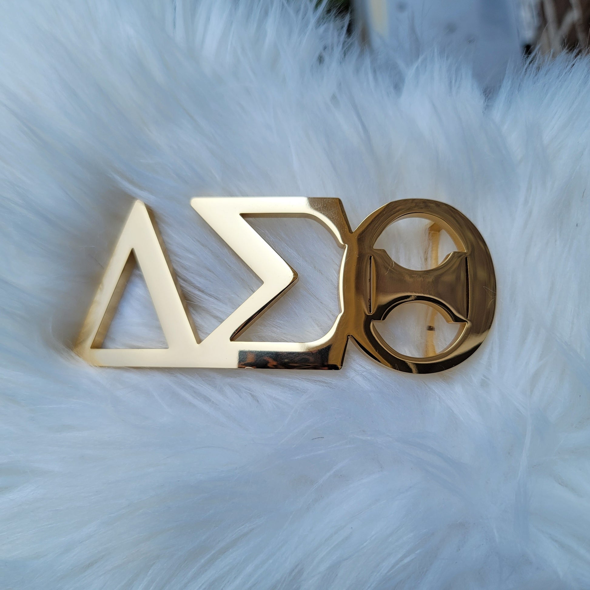 Sorority Greek letter belt Made from quality material, the buckle will not tarnish nor fade Material: stainless steel (with belt buckle only, belt not included) height 1.575 inche, width 4.6 inches. The weight of the buckle is approximately 1lb.