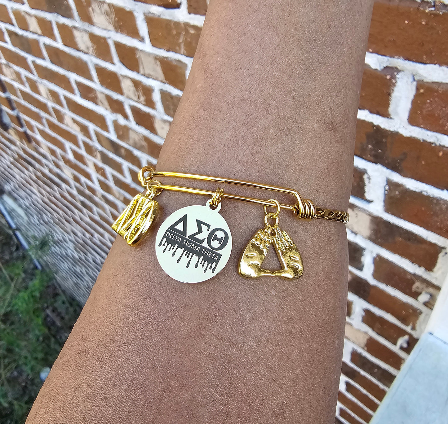 Delta Charm Bracelet Available in Gold and Silver