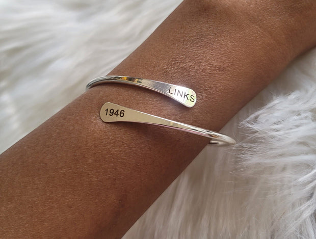 The LINKS 1946, Inc. Adjustable Cuff Bracelet Available in Silver & Gold